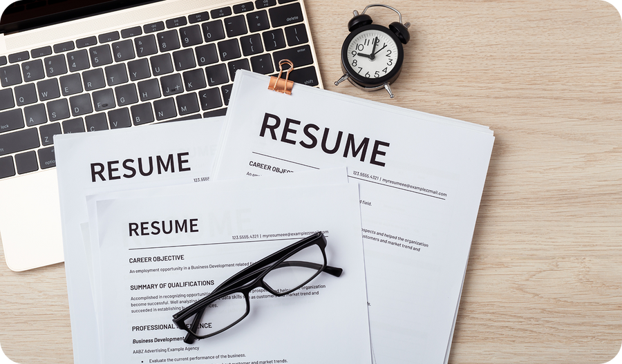 2 resume on top of a laptop and an eyeglasses