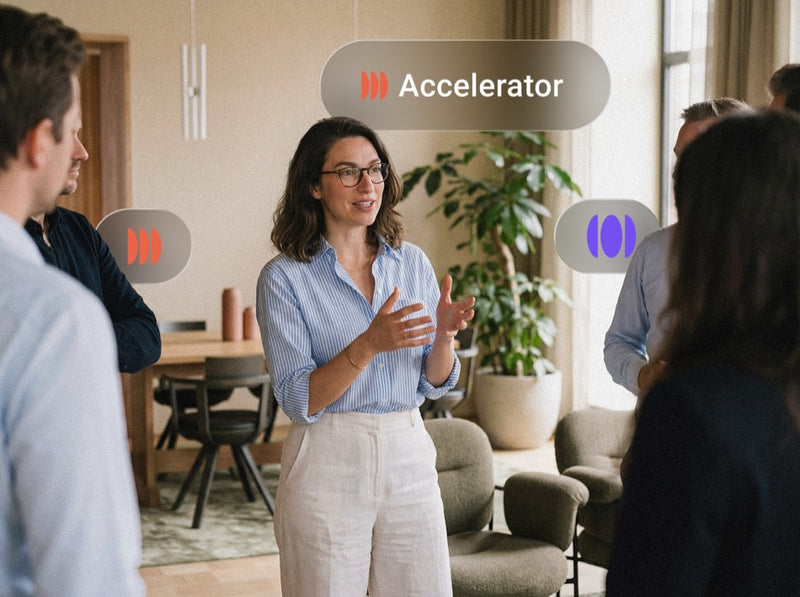 Woman presenting to colleagues, with a Pigment Accelerator profile label