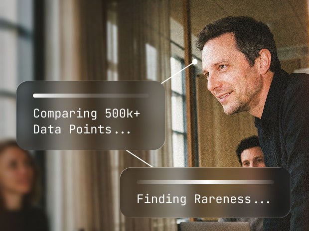 Man at a window with overlays Comparing 500k plus Data Points and Finding Rareness